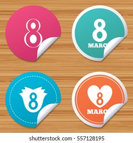 Round stickers or website banners. 8 March Women's Day icons. Tulip or rose flower and heart sign symbols. Circle badges with bended corner. Vector