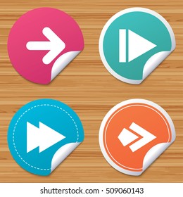 Round stickers or website banners. Arrow icons. Next navigation arrowhead signs. Direction symbols. Circle badges with bended corner. Vector