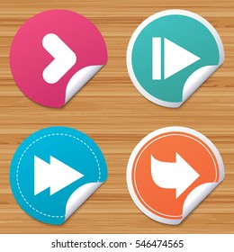Round stickers or website banners. Arrow icons. Next navigation arrowhead signs. Direction symbols. Circle badges with bended corner. Vector
