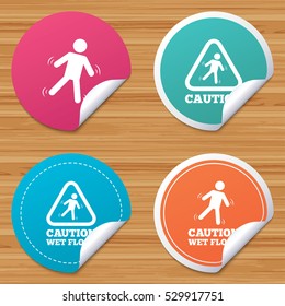Round stickers or website banners. Caution wet floor icons. Human falling triangle symbol. Slippery surface sign. Circle badges with bended corner. Vector