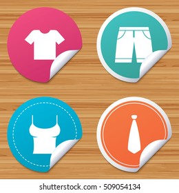 Round stickers or website banners. Clothes icons. T-shirt and bermuda shorts signs. Business tie symbol. Circle badges with bended corner. Vector