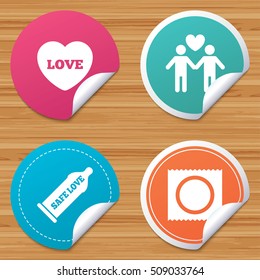 Round stickers or website banners. Condom safe sex icons. Lovers Gay couple signs. Male love male. Heart symbol. Circle badges with bended corner. Vector