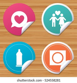 Round stickers or website banners. Condom safe sex icons. Lovers couple signs. Male love female. Speech bubble with heart. Circle badges with bended corner. Vector
