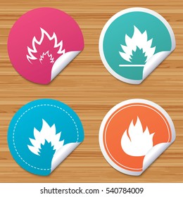 Round stickers or website banners. Fire flame icons. Heat symbols. Inflammable signs. Circle badges with bended corner. Vector