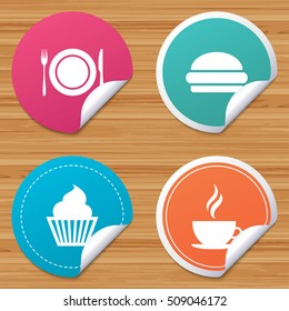 Round stickers or website banners. Food and drink icons. Muffin cupcake symbol. Plate dish with fork and knife sign. Hot coffee cup and hamburger. Circle badges with bended corner. Vector