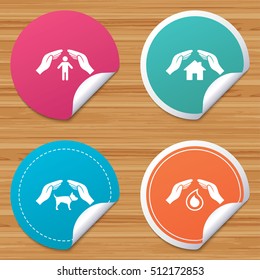Round stickers or website banners. Hands insurance icons. Shelter for pets dogs symbol. Save water drop symbol. House property insurance sign. Circle badges with bended corner. Vector