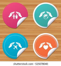 Round stickers or website banners. Hands insurance icons. Human life insurance symbols. Heart health sign. Travel flight symbol. Save world planet. Circle badges with bended corner. Vector