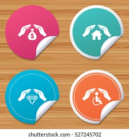 Round stickers or website banners. Hands insurance icons. Money bag savings insurance symbols. Disabled human help symbol. House property insurance sign. Circle badges with bended corner. Vector