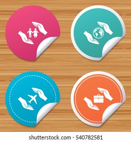 Round stickers or website banners. Hands insurance icons. Human life insurance symbols. Travel flight baggage symbol. World globe sign. Circle badges with bended corner. Vector