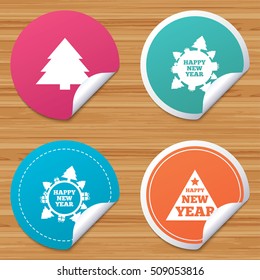 Round stickers or website banners. Happy new year icon. Christmas trees signs. World globe symbol. Circle badges with bended corner. Vector