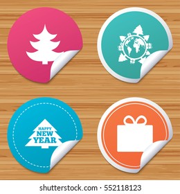Round stickers or website banners. Happy new year icon. Christmas trees and gift box signs. World globe symbol. Circle badges with bended corner. Vector