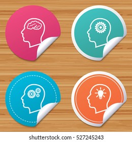 Round stickers or website banners. Head with brain and idea lamp bulb icons. Male human think symbols. Cogwheel gears signs. Circle badges with bended corner. Vector