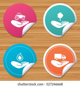 Round stickers or website banners. Helping hands icons. Agricultural tractor insurance symbol. Delivery truck sign. Save nature forest. Water drop. Circle badges with bended corner. Vector