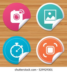 Round stickers or website banners. Hipster retro photo camera icon. Autofocus zone symbol. Stopwatch timer sign. Landscape photo frame. Circle badges with bended corner. Vector