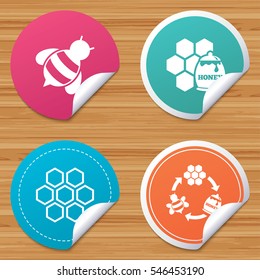Round stickers or website banners. Honey icon. Honeycomb cells with bees symbol. Sweet natural food signs. Circle badges with bended corner. Vector