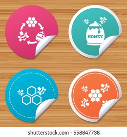 Round stickers or website banners. Honey icon. Honeycomb cells with bees symbol. Sweet natural food signs. Circle badges with bended corner. Vector