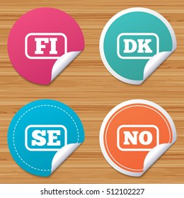 Round stickers or website banners. Language icons. FI, DK, SE and NO translation symbols. Finland, Denmark, Sweden and Norwegian languages. Circle badges with bended corner. Vector