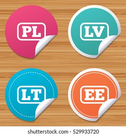 Round stickers or website banners. Language icons. PL, LV, LT and EE translation symbols. Poland, Latvia, Lithuania and Estonia languages. Circle badges with bended corner. Vector