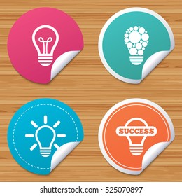 Round stickers or website banners. Light lamp icons. Circles lamp bulb symbols. Energy saving. Idea and success sign. Circle badges with bended corner. Vector
