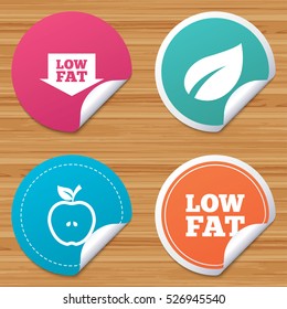Round stickers or website banners. Low fat arrow icons. Diets and vegetarian food signs. Apple with leaf symbol. Circle badges with bended corner. Vector