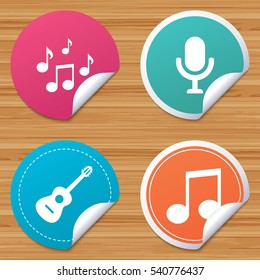 Round stickers or website banners. Music icons. Microphone karaoke symbol. Music notes and acoustic guitar signs. Circle badges with bended corner. Vector