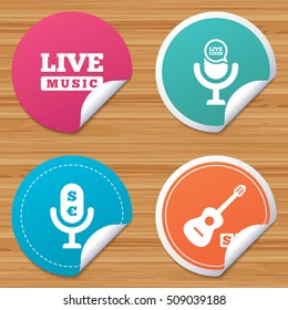 Round stickers or website banners. Musical elements icons. Microphone and Live music symbols. Paid music and acoustic guitar signs. Circle badges with bended corner. Vector