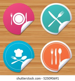 Round stickers or website banners. Plate dish with forks and knifes icons. Chief hat sign. Crosswise cutlery symbol. Dining etiquette. Circle badges with bended corner. Vector