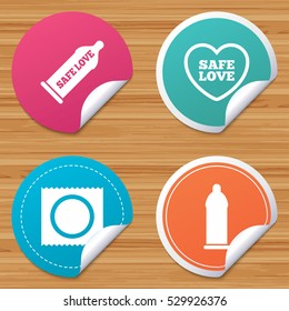 Round stickers or website banners. Safe sex love icons. Condom in package symbol. Fertilization or insemination. Heart sign. Circle badges with bended corner. Vector