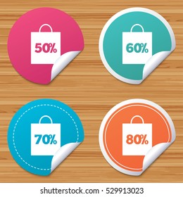 Round stickers or website banners. Sale bag tag icons. Discount special offer symbols. 50%, 60%, 70% and 80% percent discount signs. Circle badges with bended corner. Vector