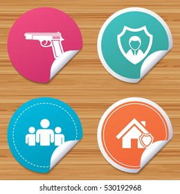 Round stickers or website banners. Security agency icons. Home shield protection symbols. Gun weapon sign. Group of people or Share. Circle badges with bended corner. Vector