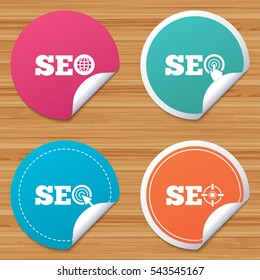 Round stickers or website banners. SEO icons. Search Engine Optimization symbols. World globe and mouse or hand cursor pointer signs. Circle badges with bended corner. Vector