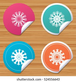 Round stickers or website banners. Snowflakes artistic icons. Air conditioning signs. Christmas and New year winter symbols. Frozen weather. Circle badges with bended corner. Vector