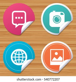 Round stickers or website banners. Social media icons. Chat speech bubble and world globe symbols. Hipster photo camera sign. Landscape photo frame. Circle badges with bended corner. Vector