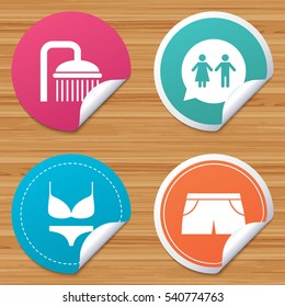 Round stickers or website banners. Swimming pool icons. Shower water drops and swimwear symbols. WC Toilet speech bubble sign. Trunks and women underwear. Circle badges with bended corner. Vector