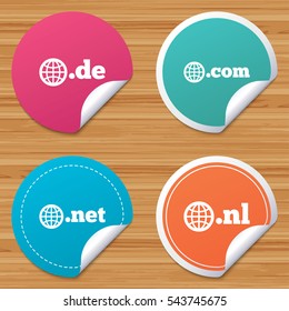 Round stickers or website banners. Top-level internet domain icons. De, Com, Net and Nl symbols with globe. Unique national DNS names. Circle badges with bended corner. Vector