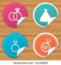 Round stickers or website banners. Wedding dress icon. Bride and groom rings symbol. Wedding or engagement day ring shine with diamond sign. Will you marry me? Circle badges with bended corner. Vector