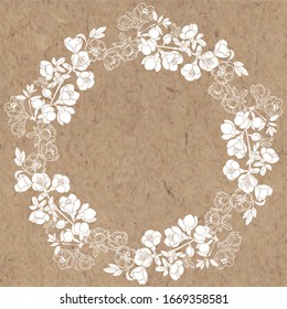 Round vector frame with blooming quince tree branches on kraft paper. Illustration with place for text, can be used creating card, menu or invitation card.
