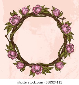 Round vintage frame made of branches with lush flowers. Decorative element for design work in the boho style.