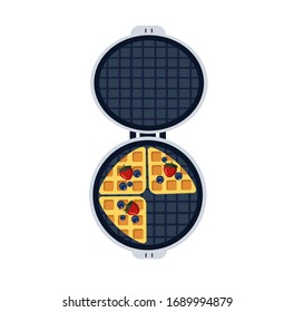 Round waffle-iron maker with Belgian waffles and berries.