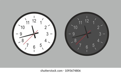 Round wall clock. White and black. isolated on gray background