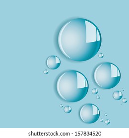 Round water droplets with light reflections on blue background