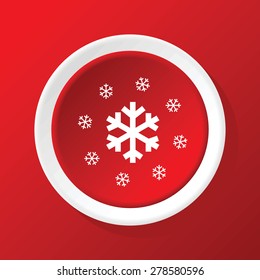 Round white icon with big snowflake surrounded by smaller ones, on red background