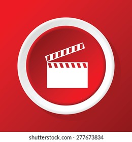 Round white icon with image of clapperboard, on red background