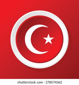 Round white icon with image of crescent and star, on red background