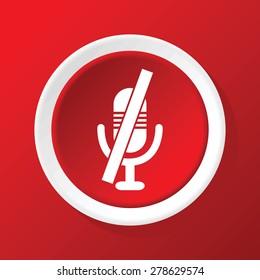Round white icon with image of muted microphone, on red background