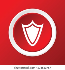Round white icon with image of shield, on red background
