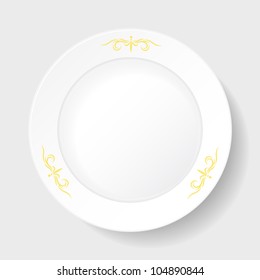 round white plate with a few gold ornaments around the edges on the white background