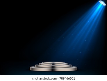 Round white podium and spotlights on dark background