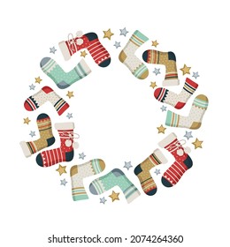 Round wreath made of New Year and Christmas socks with patterns and stars. Festive decorative element, border for design and winter holiday