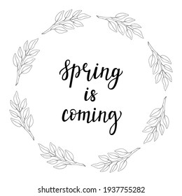 A round wreath of twigs with leaves in the doodle style and a handwritten inscription in the center - Spring is coming. The branch is hand-drawn, isolated on white.Black and white vector illustration.